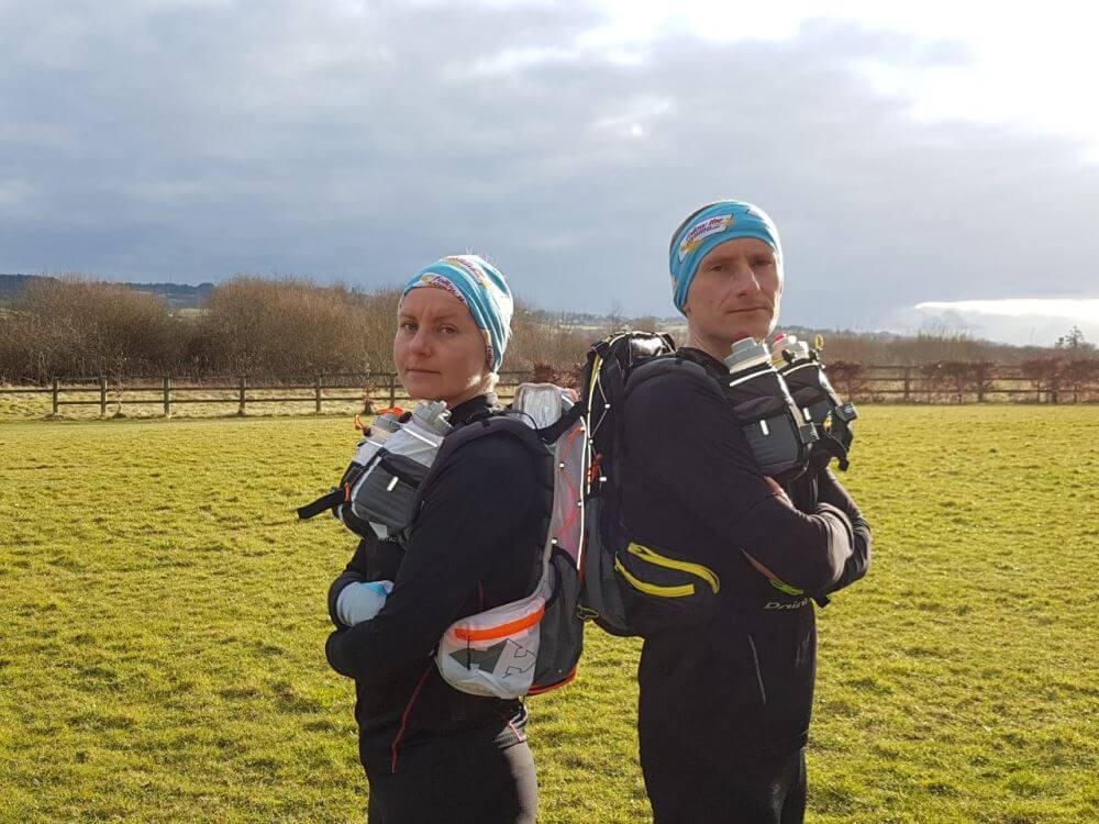 a picture of a couple of pilgrims getting ready to run the Camino
