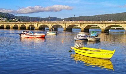 Boats in the water on the Camino de ingles route
