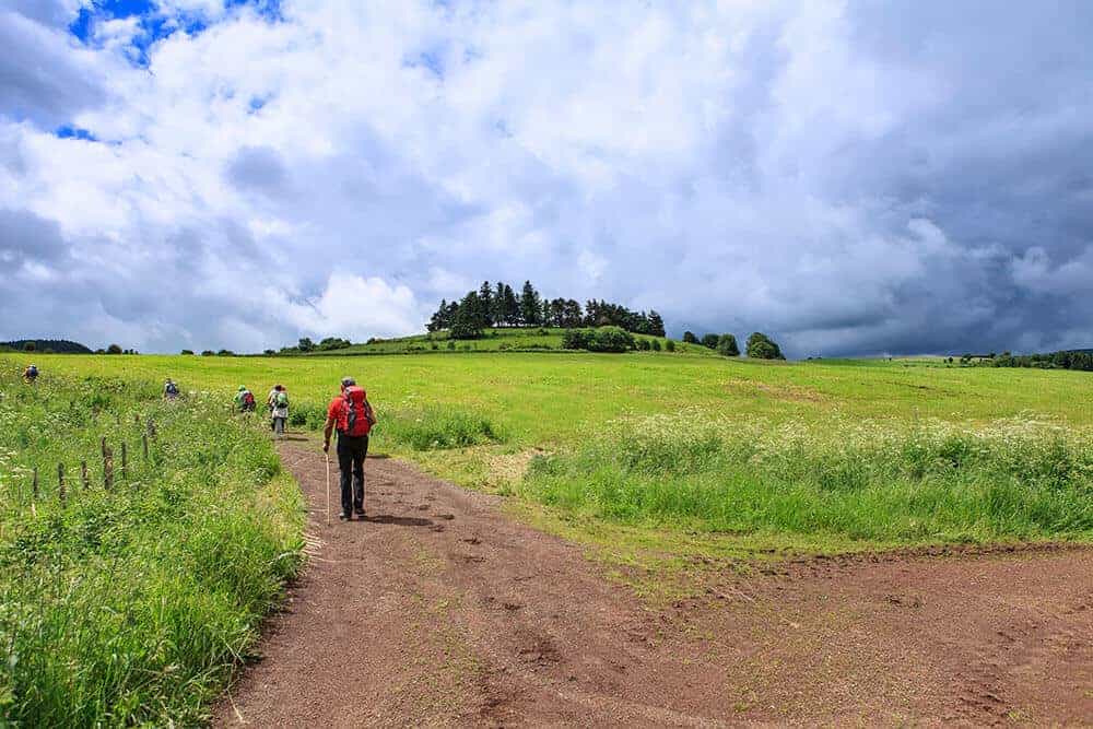 A man walking the Camino de Ingles route