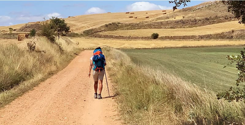 walking french way with backpack