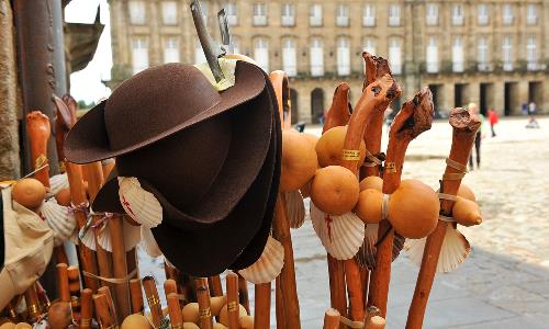 The Scallop Shell And Other Symbols of The Camino hat walking poles
