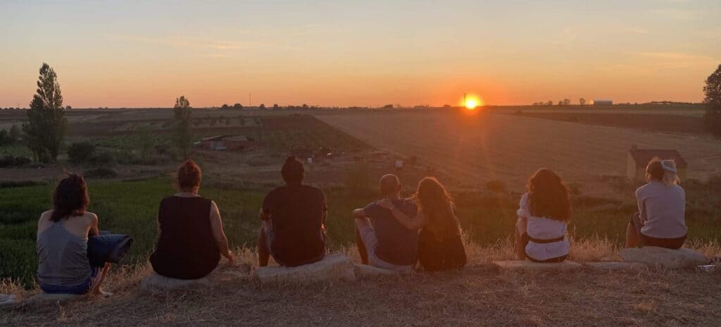 camino walkers watching the sunset