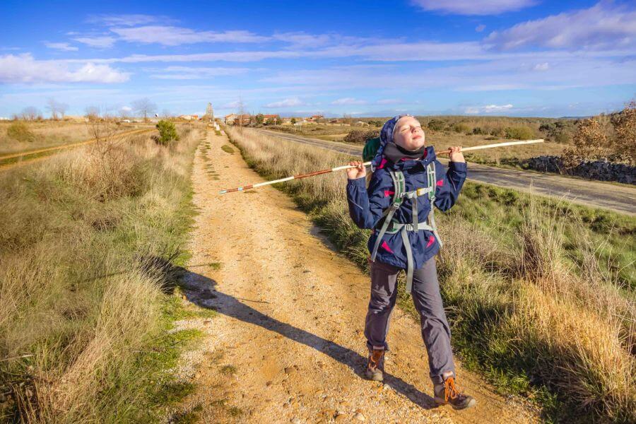 a picture of a pilgrim walking a path