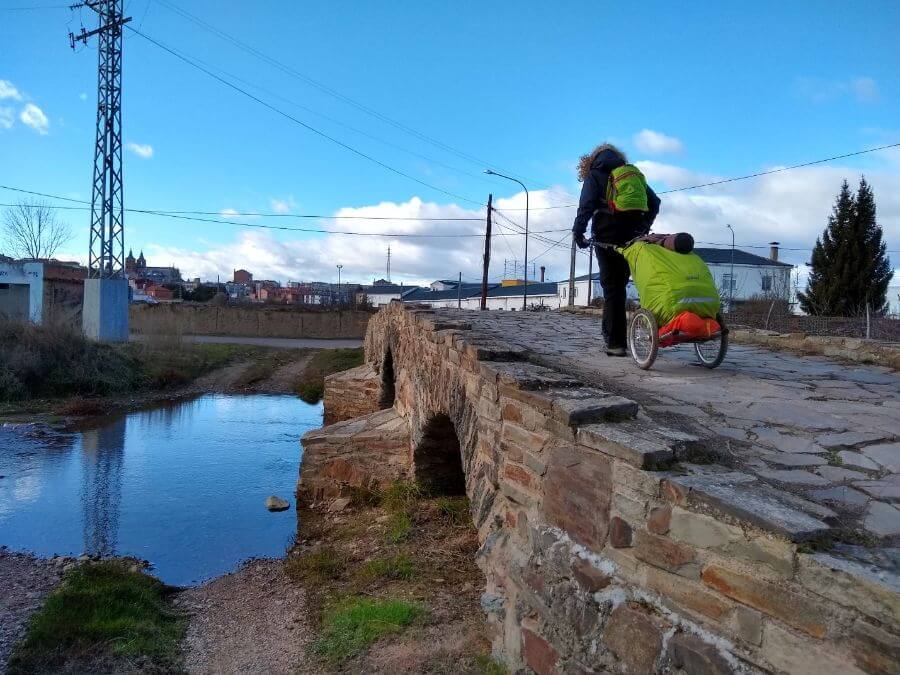a picture of a pilgrim walking through the town