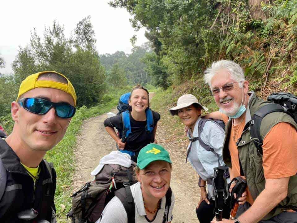 a picture of a group of pilgrims on their way to the forest