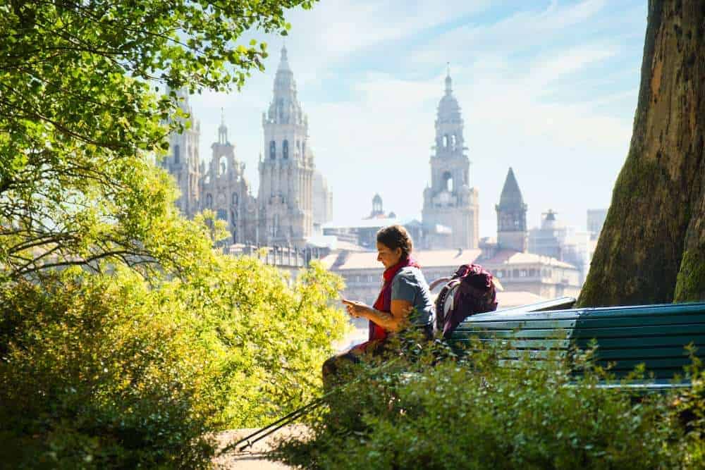 a picture of a pilgrim sitting in front of the cathedral