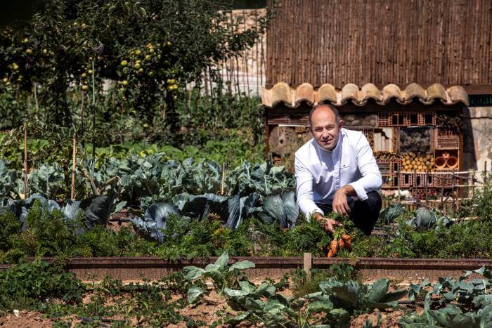 Venta Moncalvillo chef in vegetable garden Michelin star restaurant on the Camino Frances
