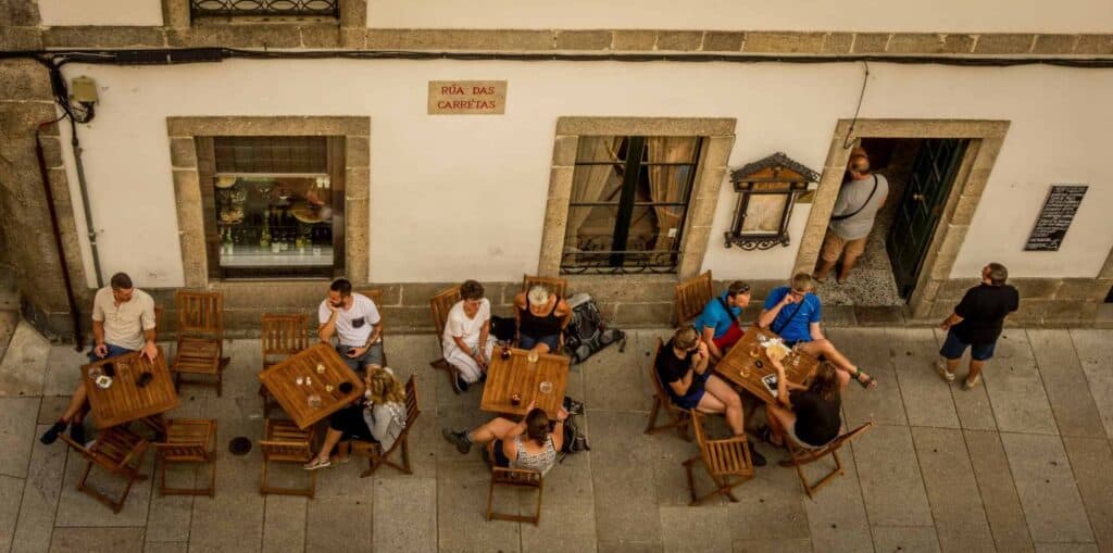 people sitting outside a cafe on the Camino