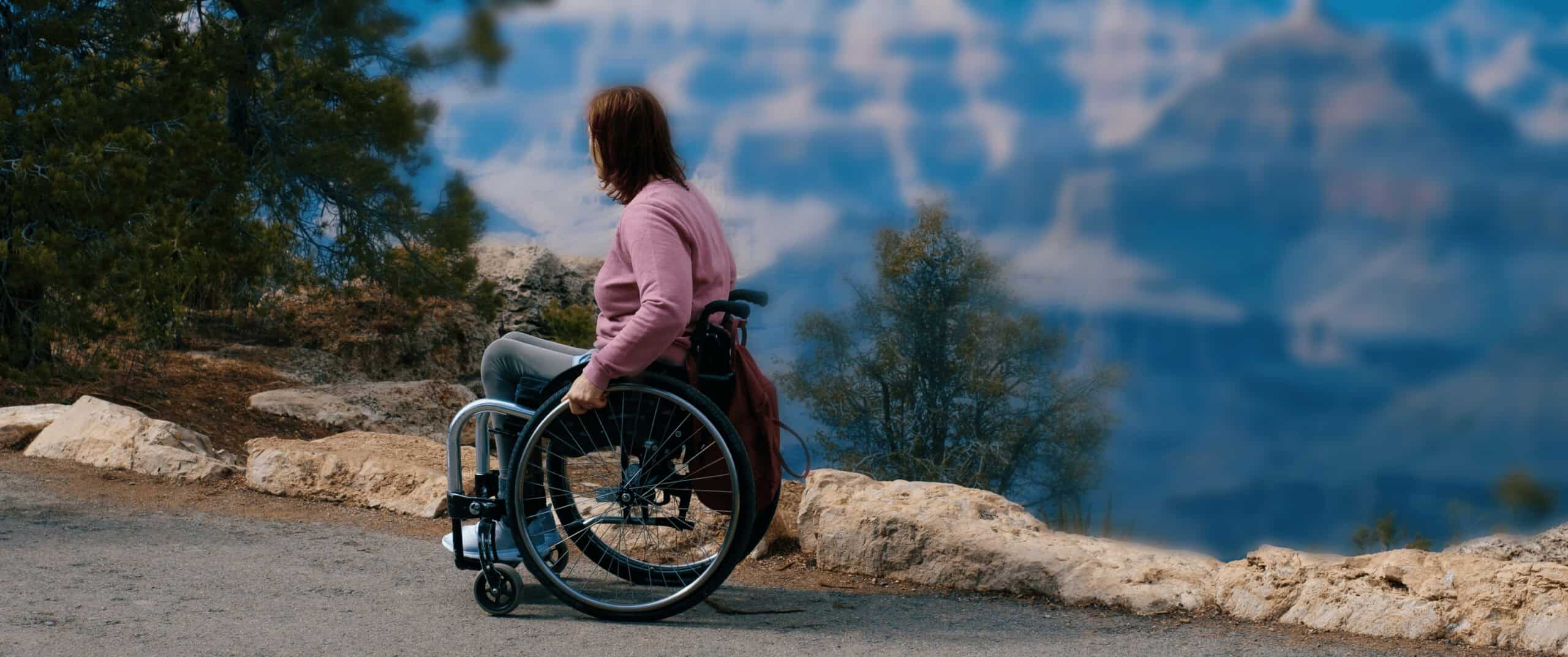 A woman using a wheelchair on a natural path Camino
