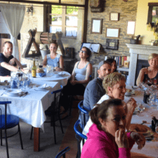 Pilgrim guided group sitting in restaurant
