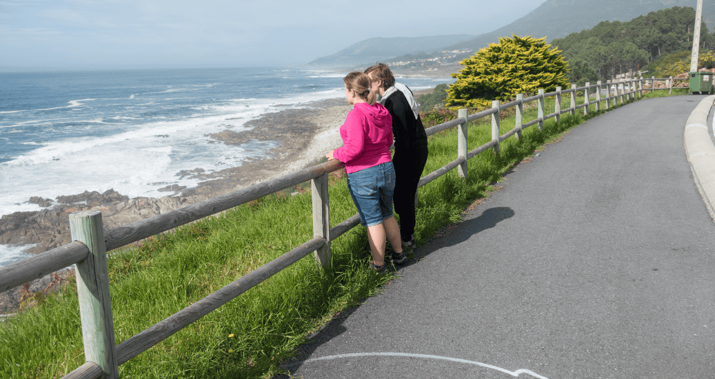 2 pilgrims looking over beach