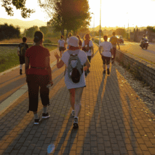 Pilgrims walking on sunset
