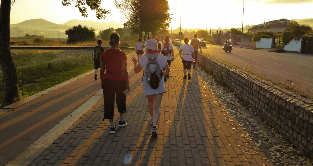 Pilgrims walking on sunset