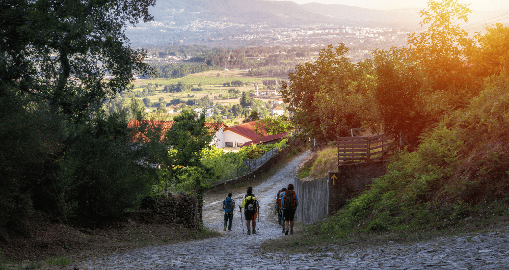Pilgrims walking at sunset