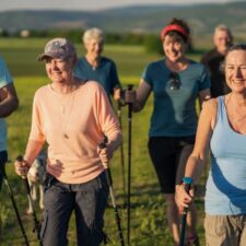 Old family walking the camino with walking poles