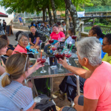 Group of pilgrims drinking wine