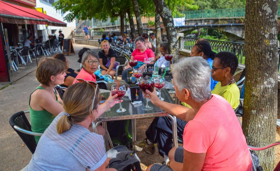 Group of pilgrims drinking wine