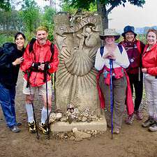 Group of pilgrims in front of monument
