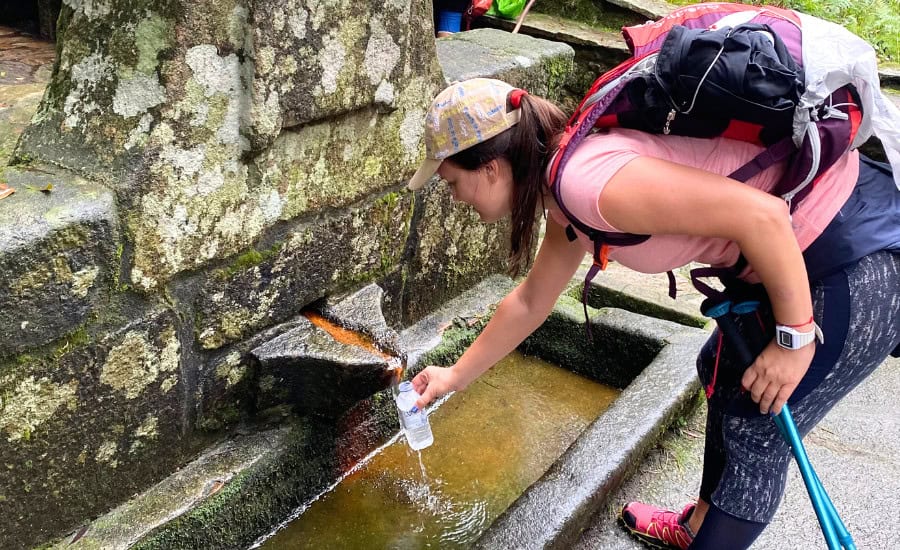 Pilgrim filling bottle from natural fountain