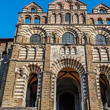 The facade of Le Puy Cathedral in Le Puy-en-Velay town. Haute-Loir department, Auvergne-Rhone-Alpes region in France