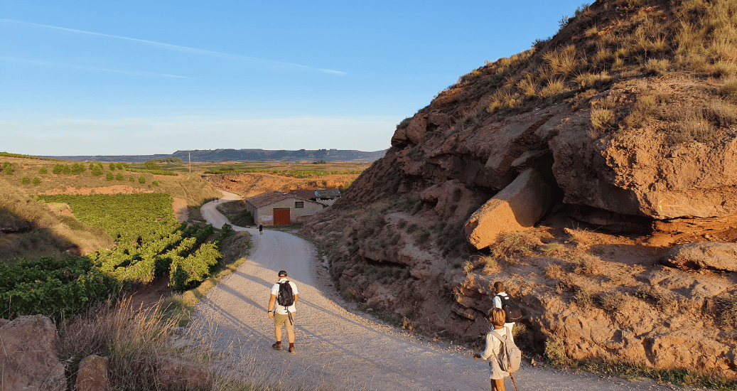Pilgrims walking through mountains Camino frances