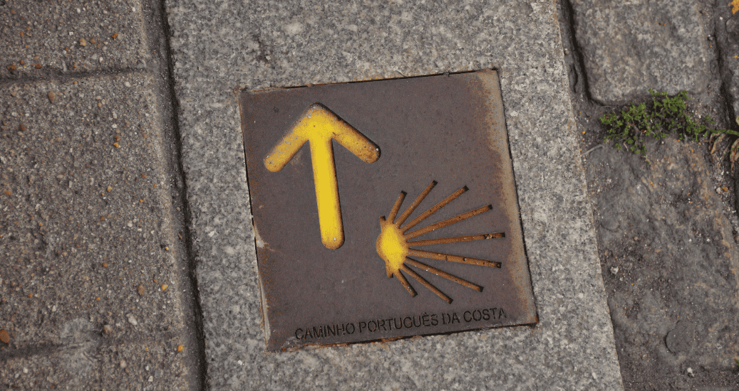 Yellow arrow Camino Portugues coastal