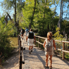 Family crossing bridge on Camino Frances