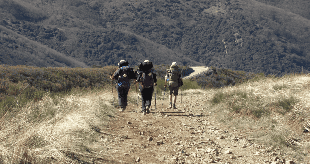 Pilgrims walking through mountains