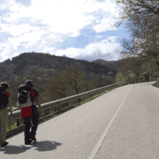 Pilgrims walking through mountain valley