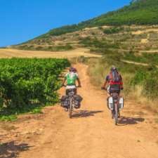 2 pilgrims cycling along camino frances