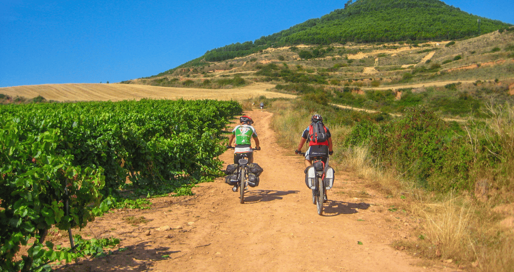 2 pilgrims cycling along camino frances
