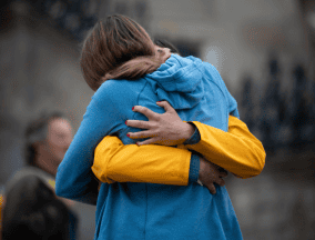 Couple hugging outside Santiago de compostela