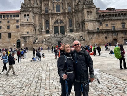 Couple posing in front of cathedral