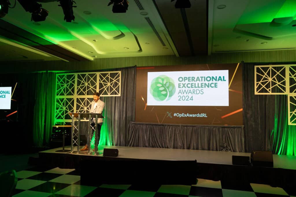 The host of the Operational Excellence Awards addressing the crowd