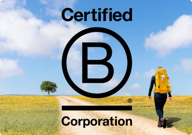 Pilgrim walking on camino frances with B-corp logo