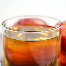 Asturian apple cider and a red apple