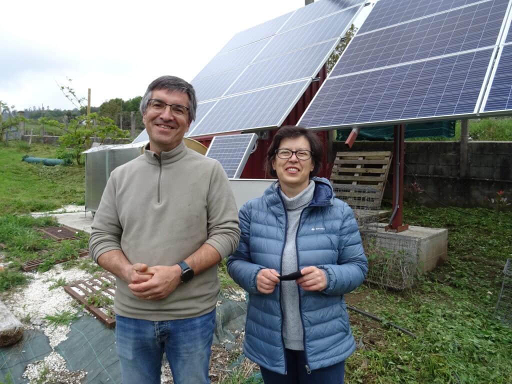 Galician farmers using solar panels to dehydrate fruits and vegetables for snacks, showcasing the work being done to make food on the Camino more sustainable